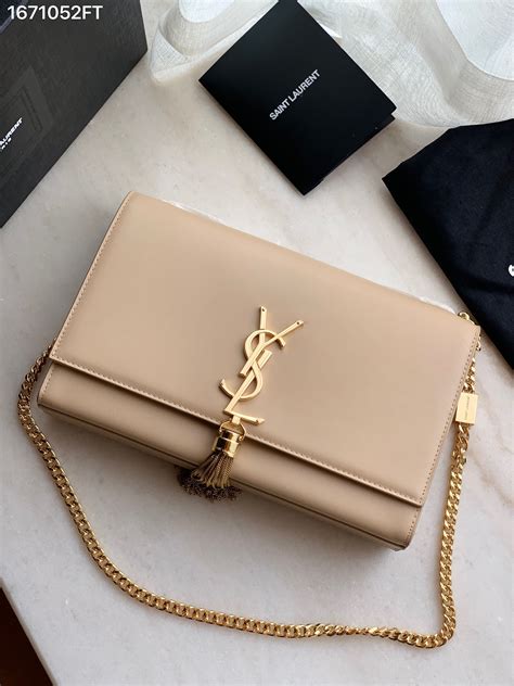 ysl beige clutch|ysl clutch bag with tassel.